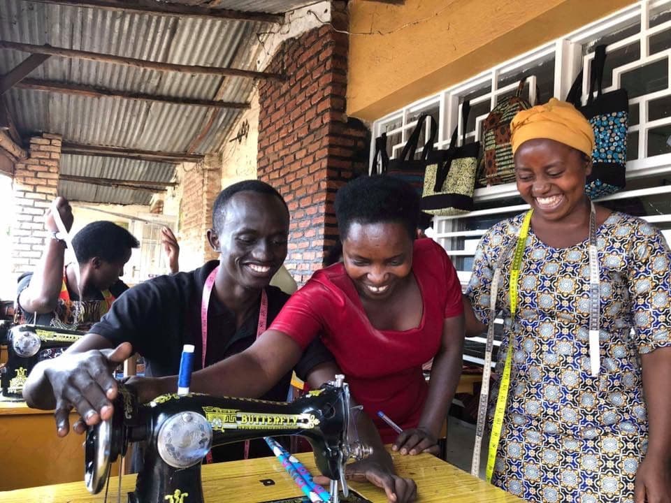 Mama Rwanda trainees at a sewing machine
