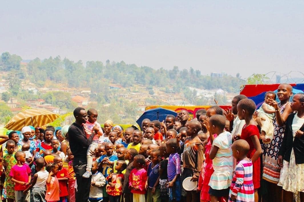 Bertrand Ishimwe with a large group of Irembo children and youth
