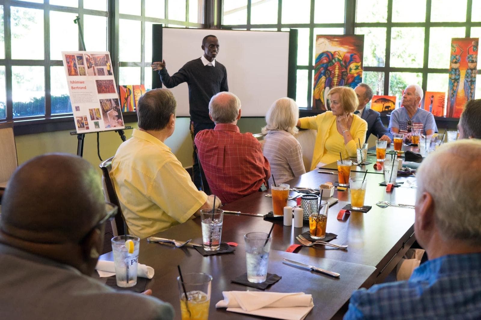 Bertrand Ishimwe speaking to supporters in the United States