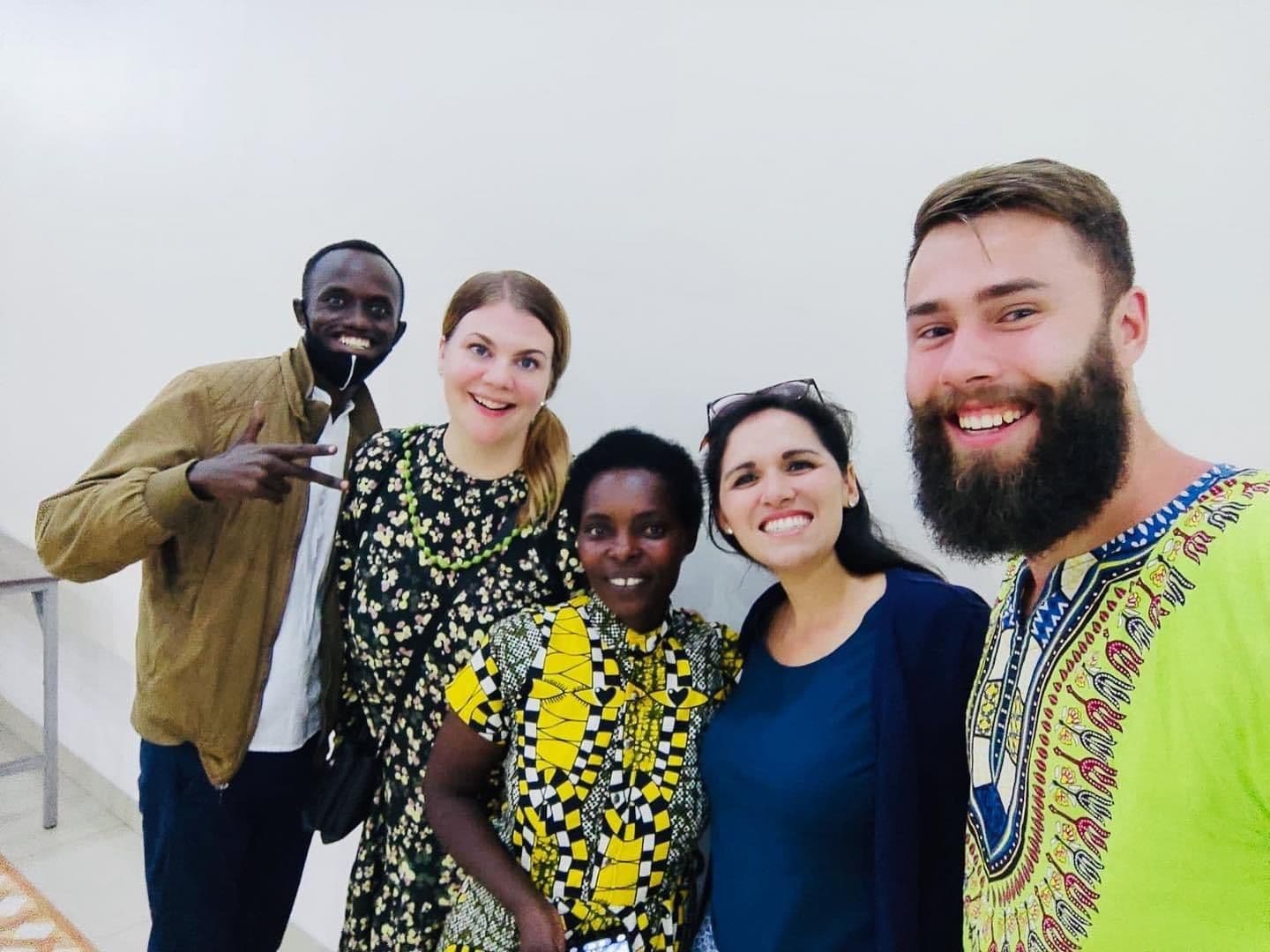 Friends from abroad smiling with Irembo team members