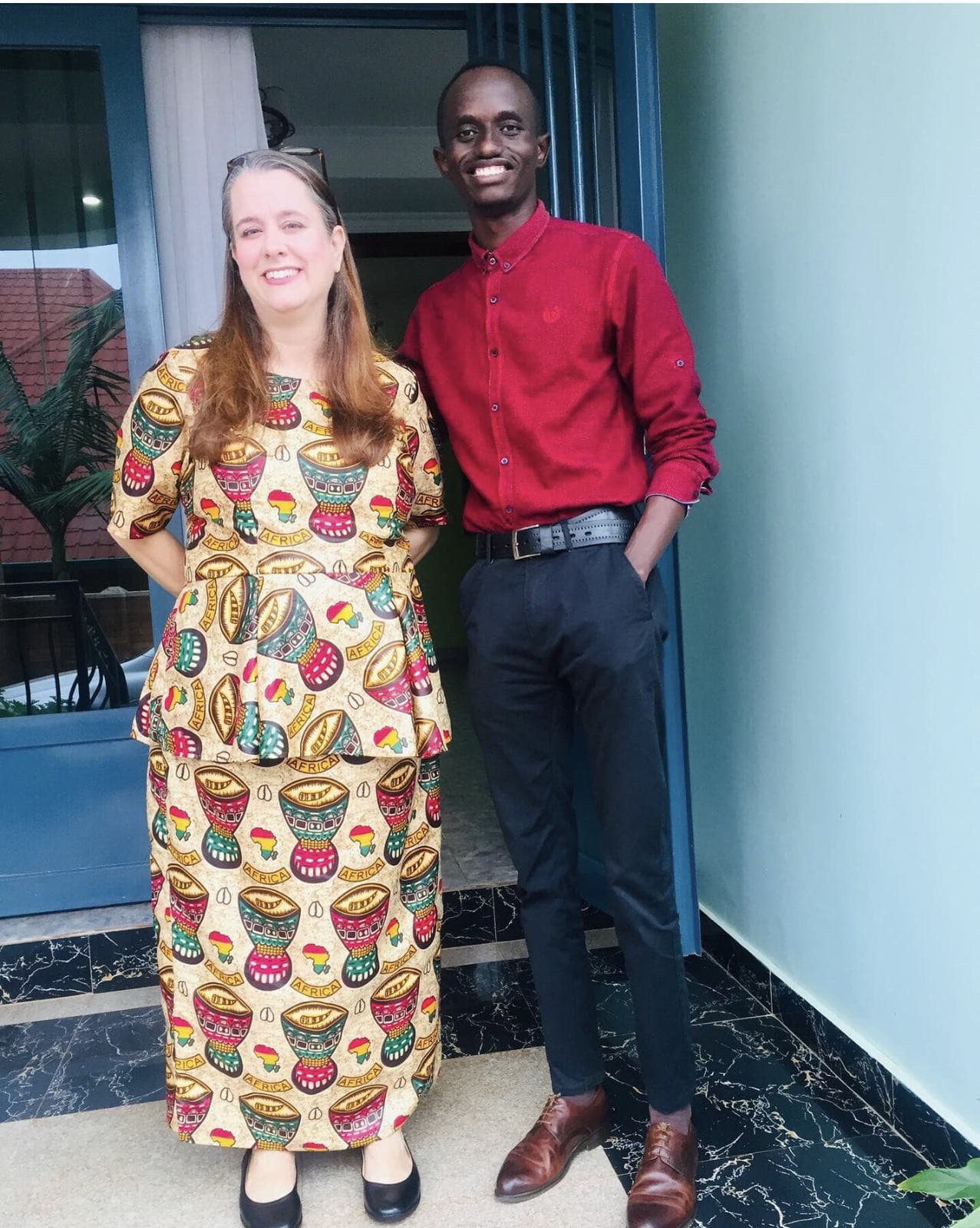 A guest with Bertrand Ishimwe at the entrance