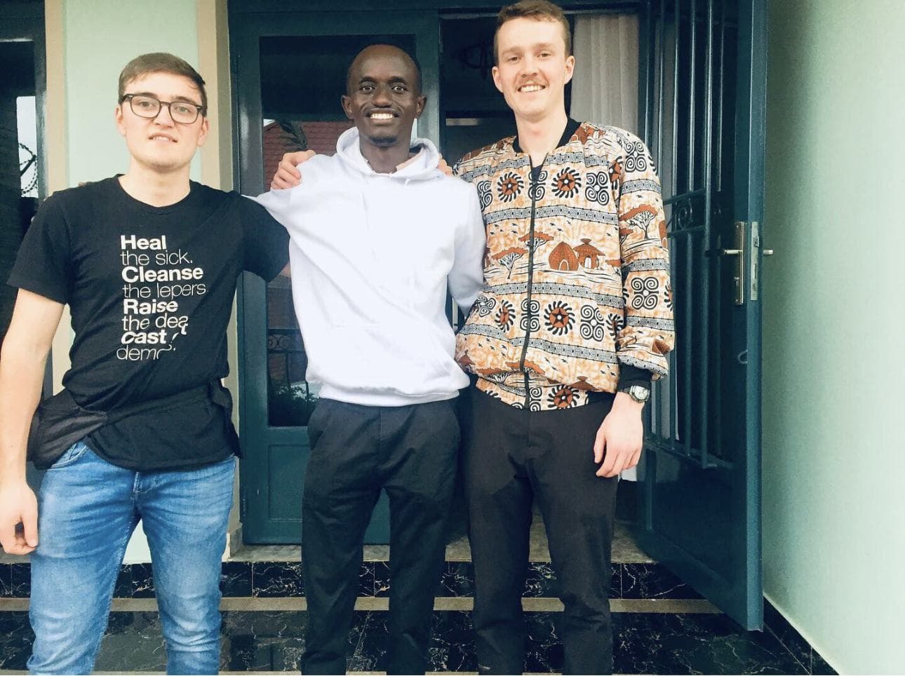 Two young visitors with Bertrand Ishimwe
