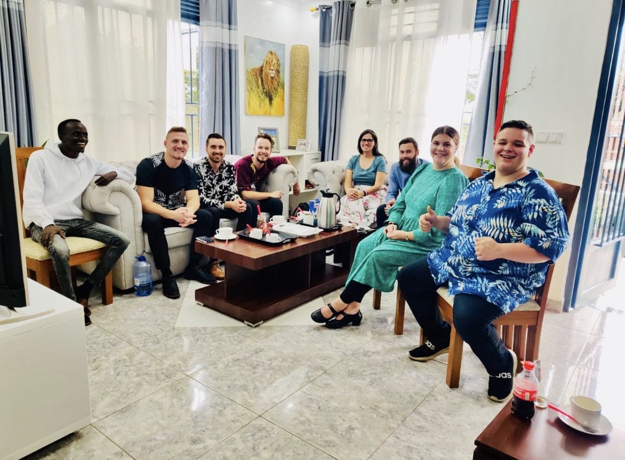 Guests with Bertrand Ishimwe in the guest lounge