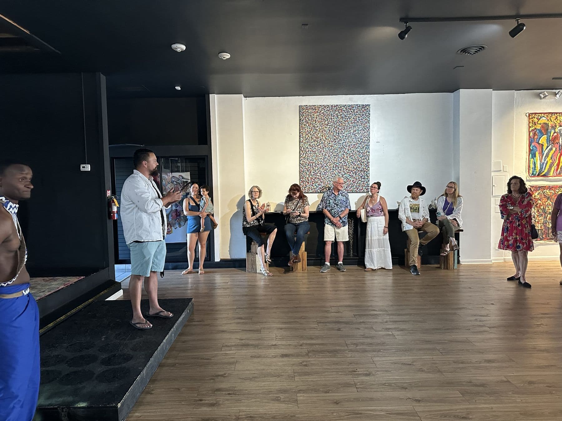 Guests at an Irembo US event in an art gallery hung with East African paintings