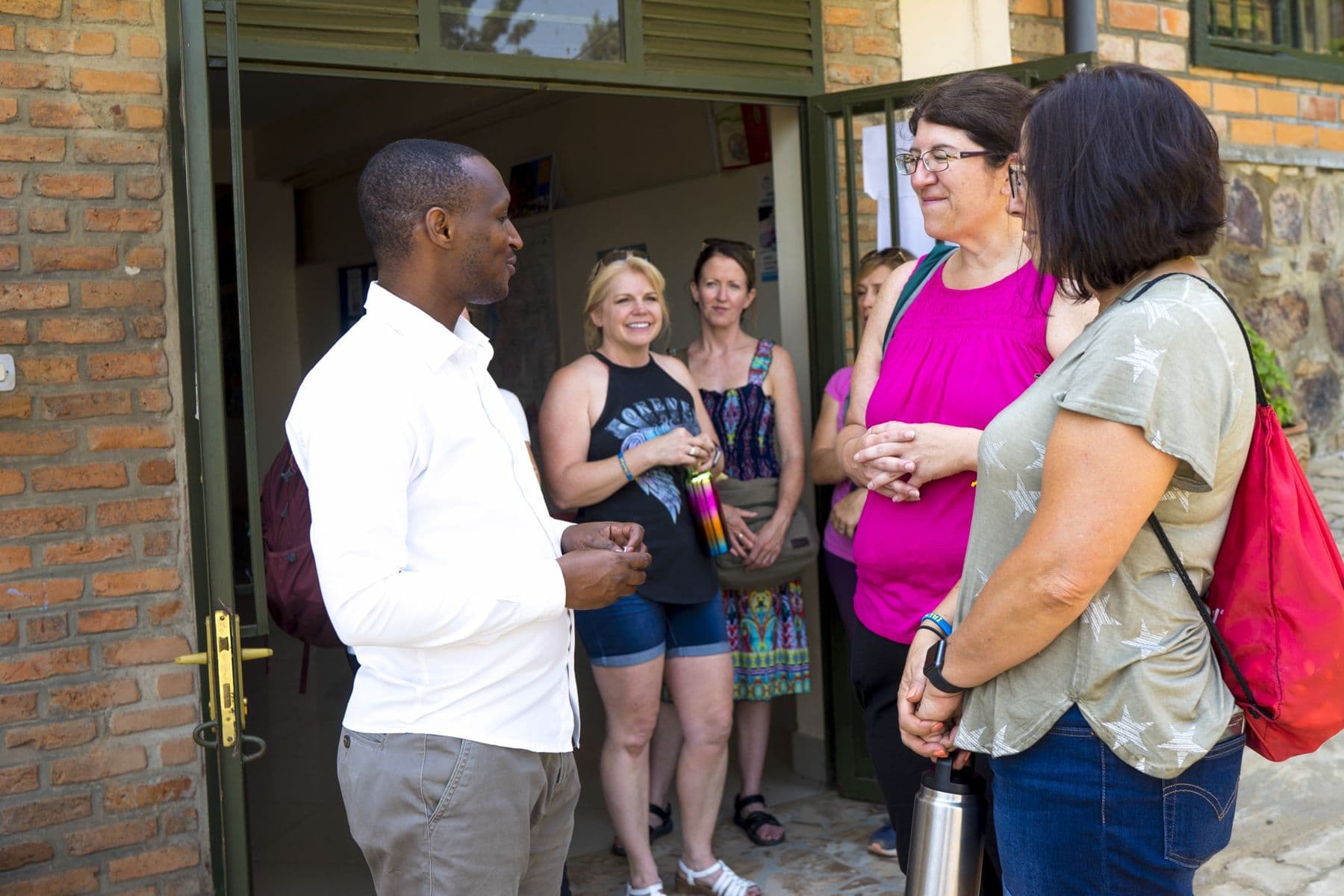 An Irembo team member welcoming visitors at the center