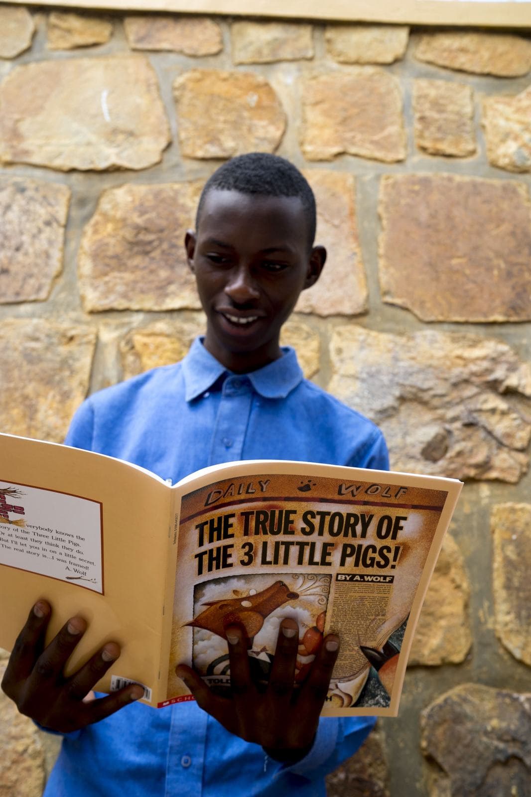 A young student reading a picture book